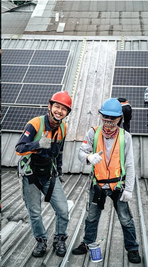 Solar technicians on the CSB factory roof